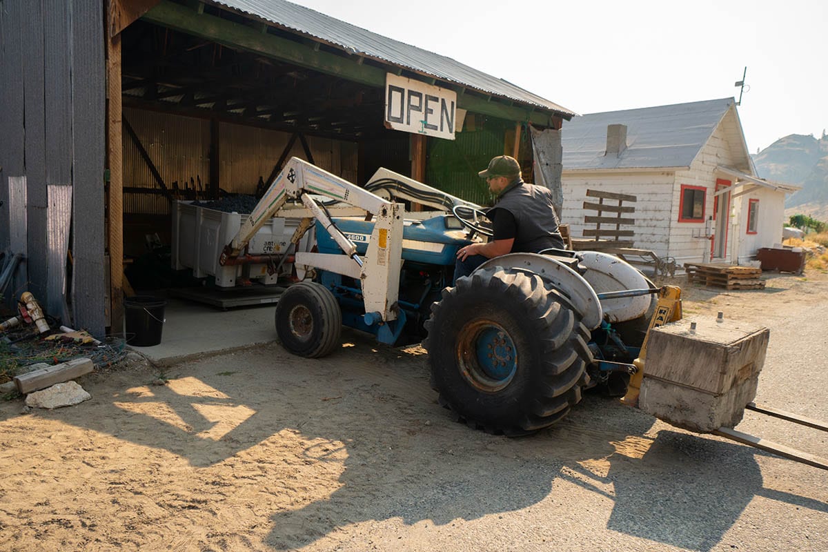 Brock driving tractor